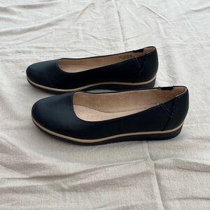 Black slip on flats with slight wedge heel by Natrualizer